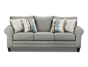 Gray sofa with patterned cushions on a white background